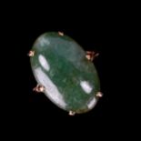 A large 9ct gold jade panel ring, set with oval cabochon jade, measuring 23.65mm x 15.18mm x 6.17mm,