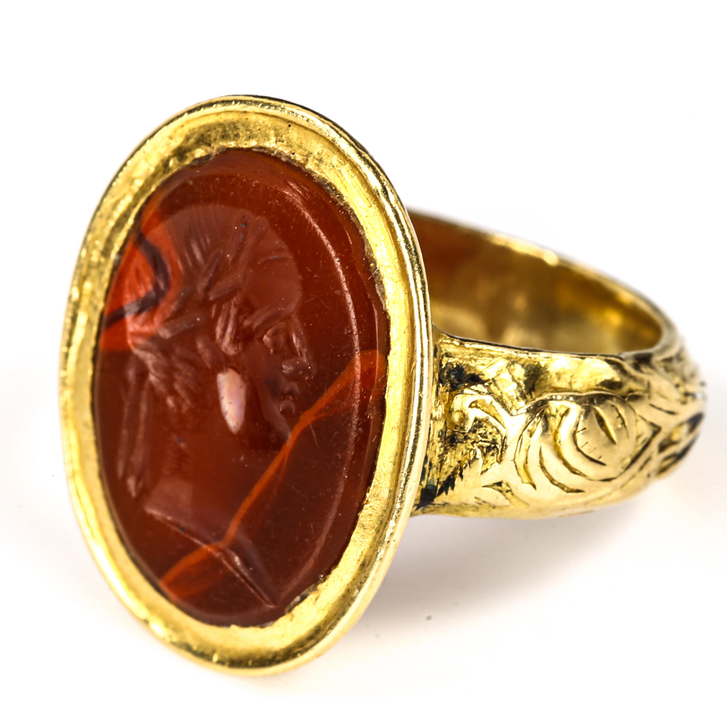 An Antique hardstone seal ring, heavy unmarked high carat gold settings, with intaglio carved male - Image 2 of 5