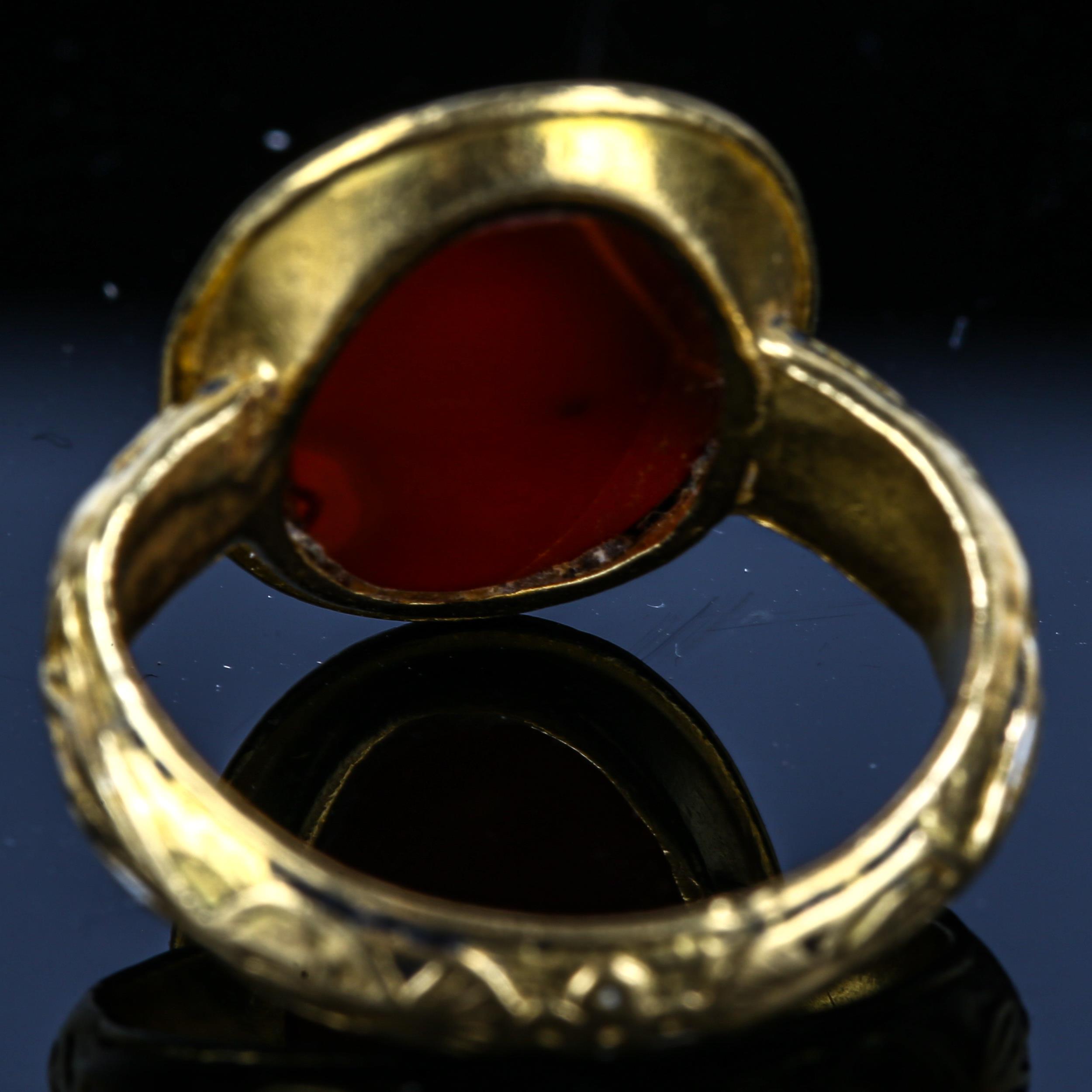 An Antique hardstone seal ring, heavy unmarked high carat gold settings, with intaglio carved male - Image 4 of 5