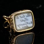 An Antique chalcedony seal fob, unmarked yellow metal settings, with relief floral decoration and