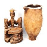 African Tribal carved and painted wood figure, height 26cm, and a wooden water pot with aluminium