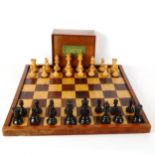 A Staunton pattern boxwood and ebonised chess set, with weighted pieces, King height 9cm, no maker's