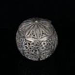 An unmarked Continental white metal filigree ball-shaped spice container, early 20th century, height