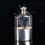 An Edwardian silver and glass spirit flask with removeable cup base, by Mappin & Webb, hallmarks