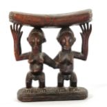 African carved wood Tribal headrest, Luba Zaire, supported by 2 standing figures, height 18cm