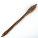 An Australian Aboriginal club with incised decoration, length 63cm A number of minor splits