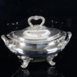 A large silver plated 2-handled soup tureen and cover, with cast foliate decoration on scrolled