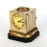 An Art Deco Mappin & Webb revolving cube-shaped combination desk compendium, comprising clock,