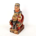 A Chinese carved painted and gilded figure on a lion design throne, early 20th century, height