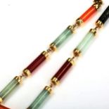 A modern Chinese 9ct gold jade panel bracelet, length 19cm, 6.5g No damage or repairs, no broken
