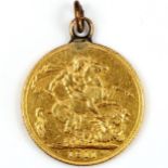 A George V 1911 gold full sovereign coin, with pendant loop, 8.2g