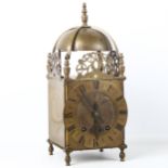 A large brass lantern clock, engraved Roman numeral chapter ring with English movement, back plate