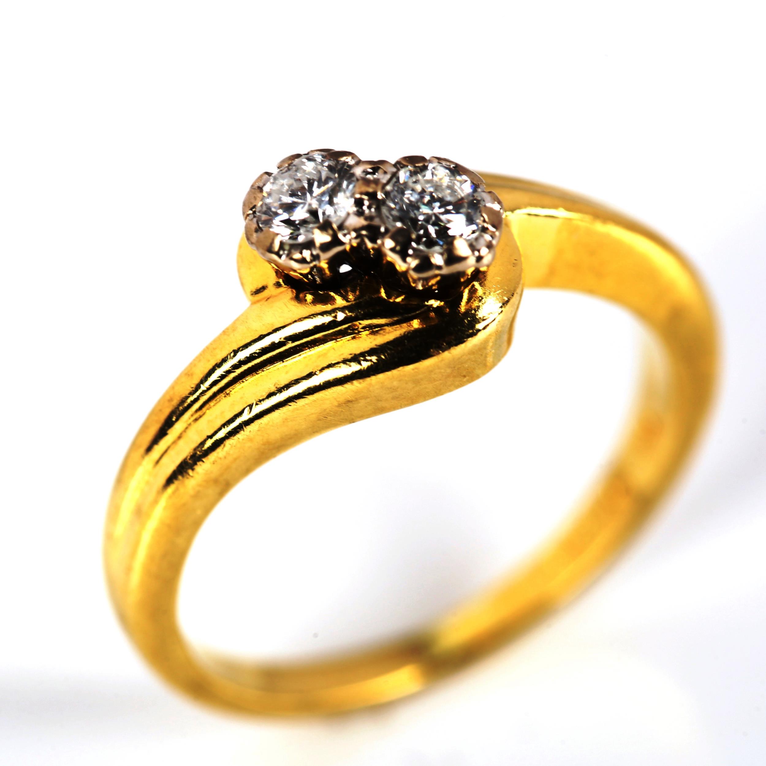 A modern 18ct gold two stone diamond crossover ring, set with modern round brilliant-cut diamonds, - Image 2 of 4