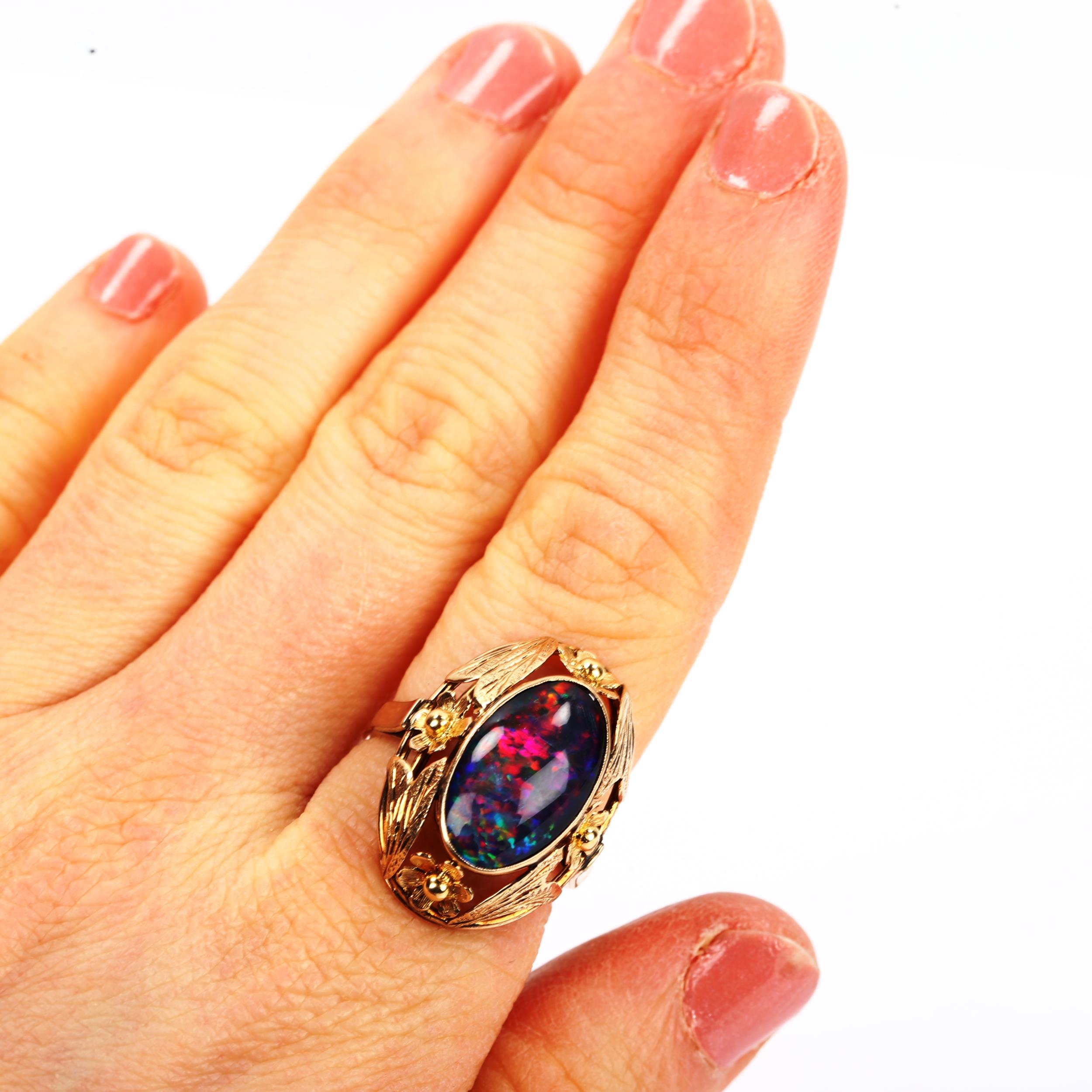A large Continental black opal doublet dress ring, unmarked gold settings with floral bezel, setting - Image 4 of 4