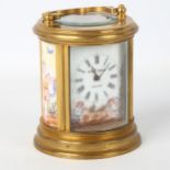 A French miniature brass cased circular carriage clock, handpainted white enemal dial with Roman