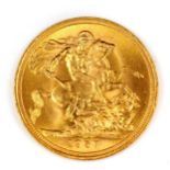 An Elizabeth II 1957 gold full sovereign coin, 7.9g