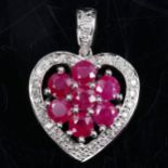 A modern 9ct white gold ruby and diamond cluster heart pendant, pendant height 23.1mm, 2.5g No