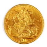 A George V 1911 gold full sovereign coin, 7.9g
