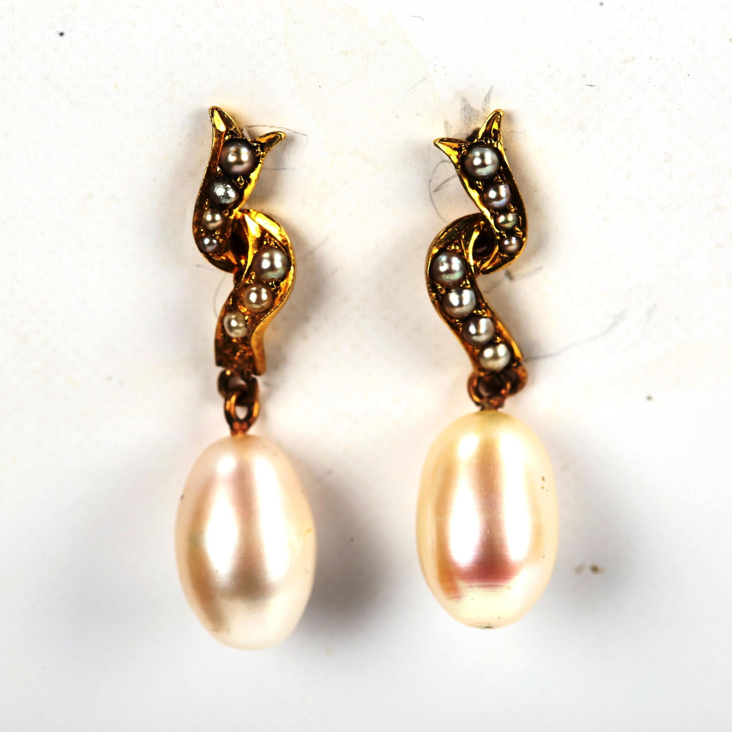 A pair of unmarked gold pearl drop earrings, earring height 30.7mm, 4.3g No damage, earring backs