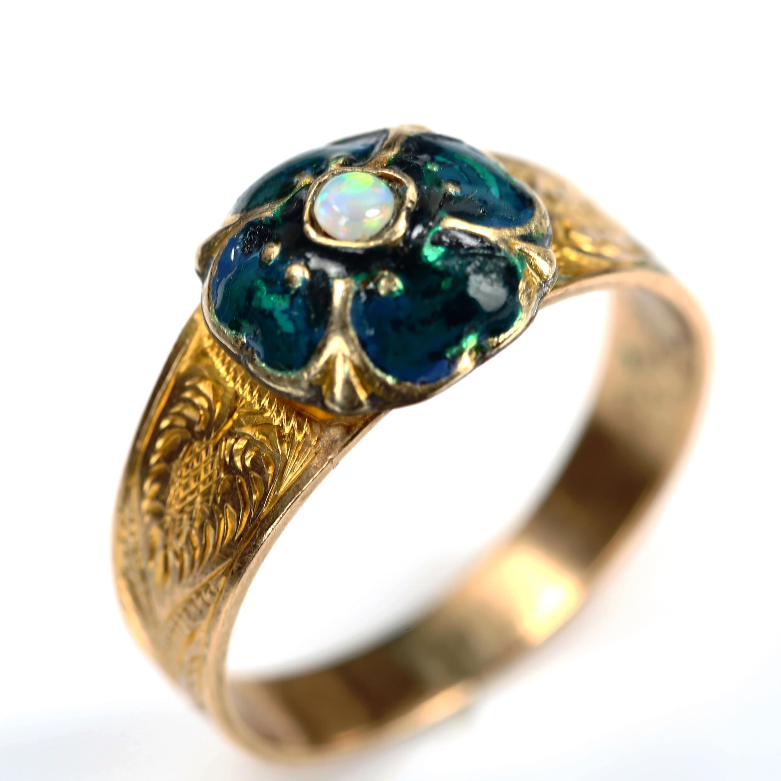 An Antique opal and enamel clover ring, unmarked gold settings with floral engraved shoulders, - Image 2 of 4