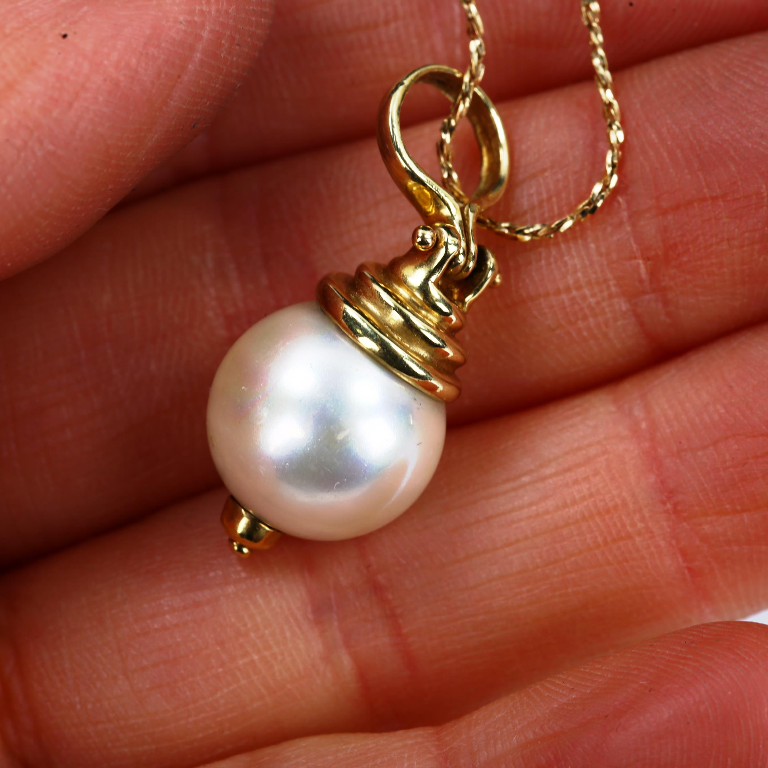 A modern cultured pearl pendant necklace, with unmarked 14ct gold mount and 18ct chain, pendant - Image 4 of 4