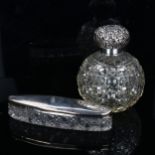 An Edwardian silver-topped glass dressing table toilet jar, and another torpedo example (2) Both