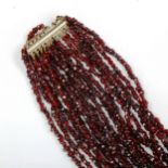 A 10-strand garnet bead necklace, length 44cm, 120g No damage or repairs, clasp working