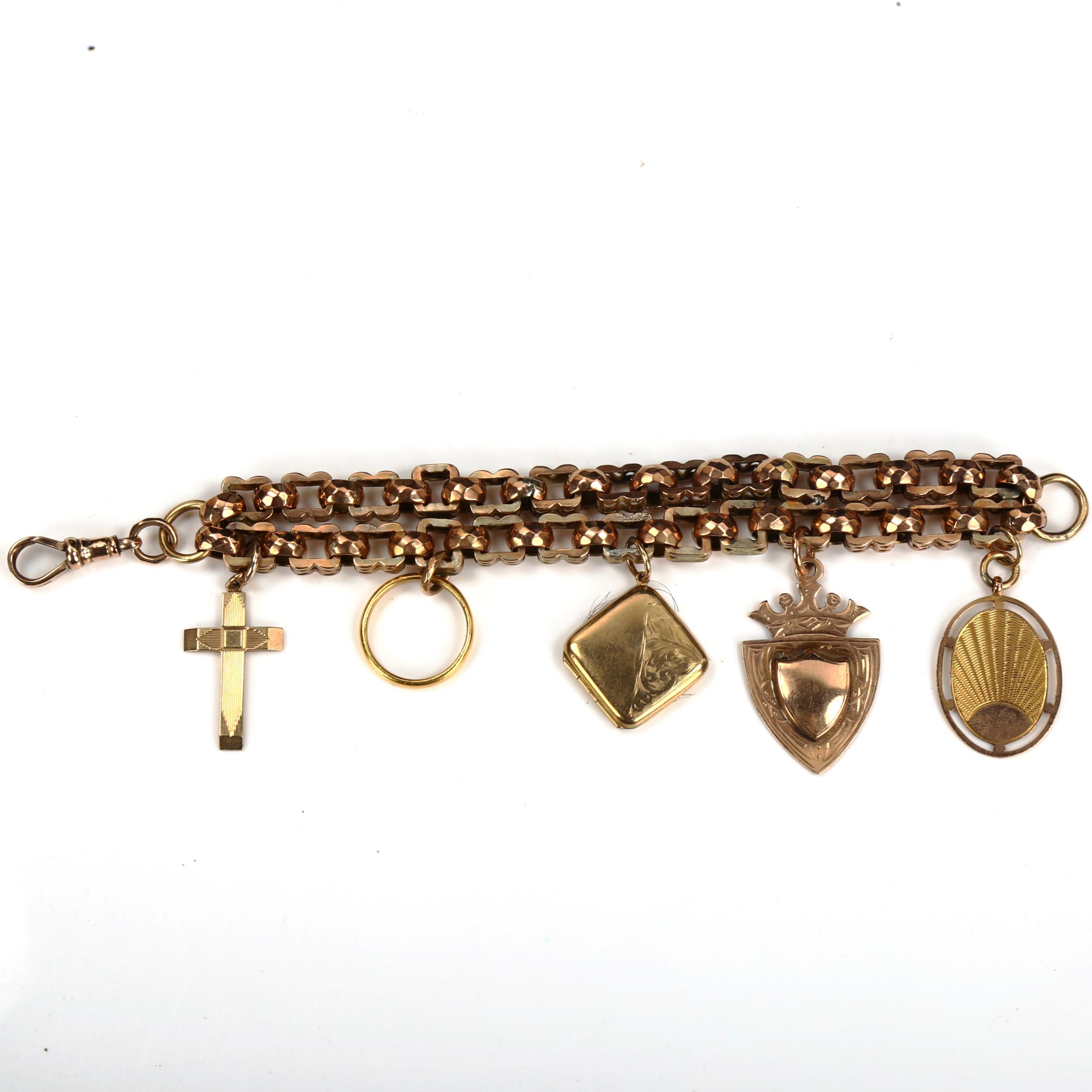 An unmarked gold double fancy link chain charm bracelet, tests as 9ct, with various charms,
