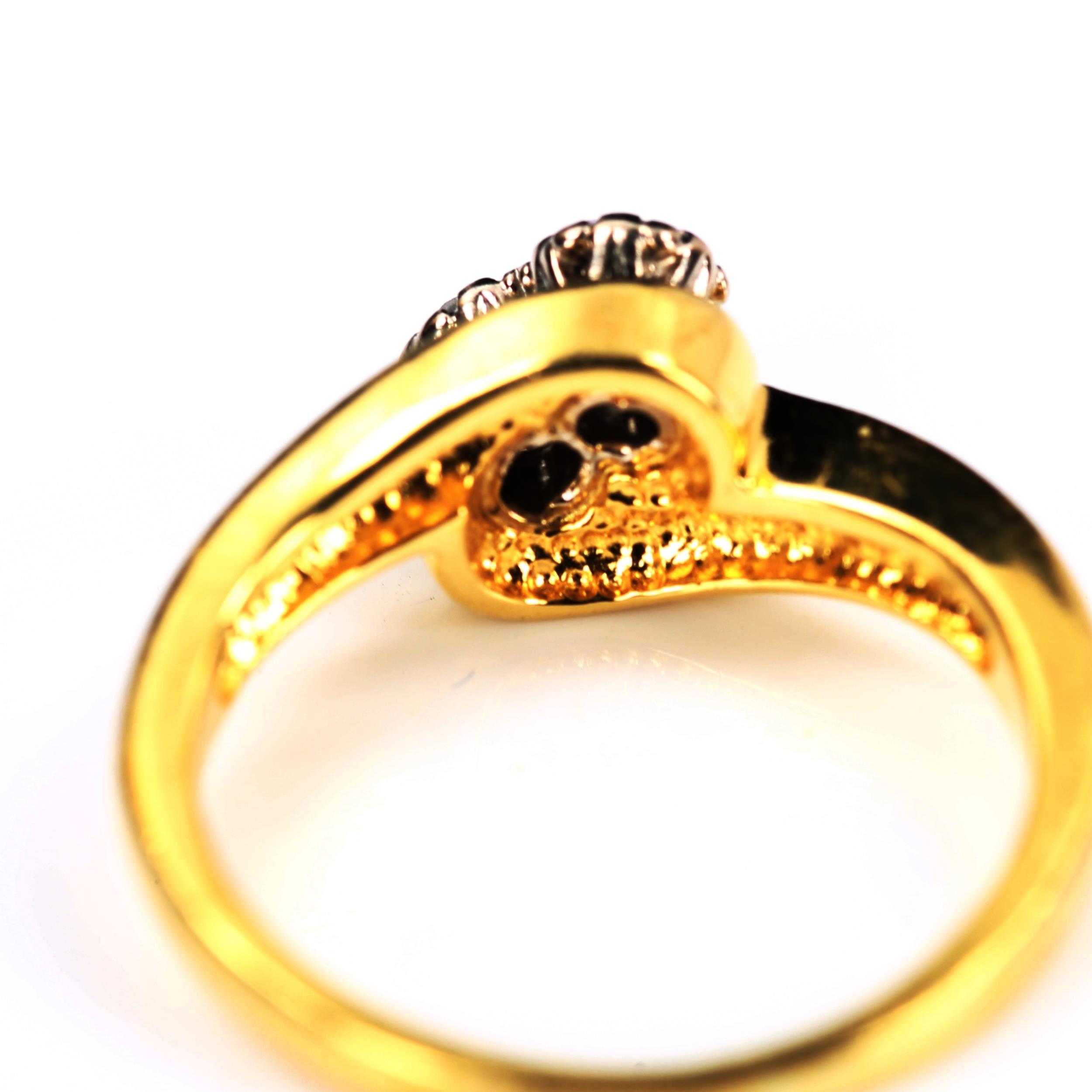 A modern 18ct gold two stone diamond crossover ring, set with modern round brilliant-cut diamonds, - Image 3 of 4