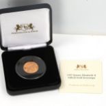 An Elizabeth II 1957 Gillick gold uncirculated full sovereign coin, boxed with certificate of