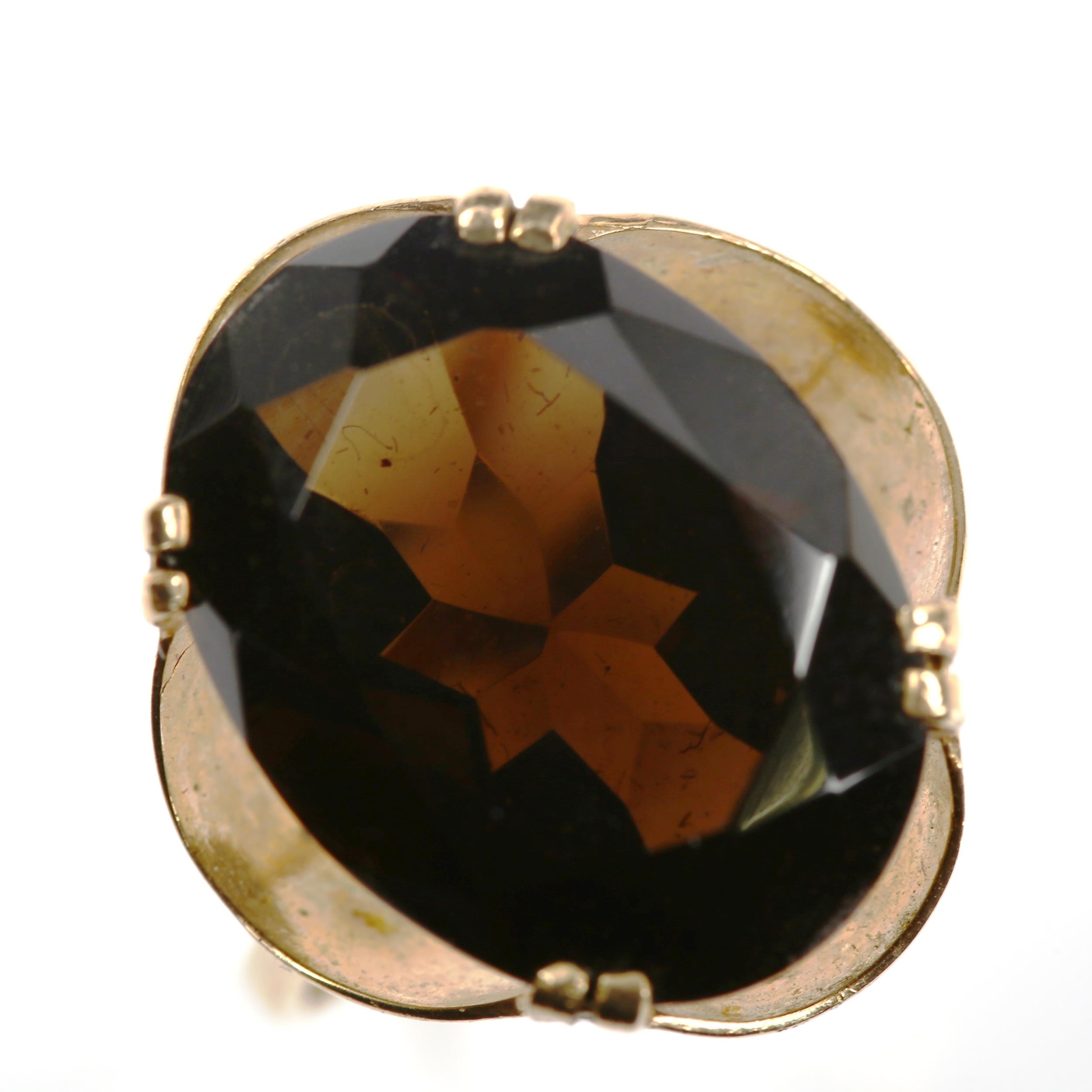 A Continental unmarked gold smoky quartz dress ring, setting height 17.8mm, size M, 3.6g No damage