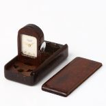 VAN CLEEF AND ARPELS - a mid-20th century miniature rosewood travel clock / timepiece, silvered dial