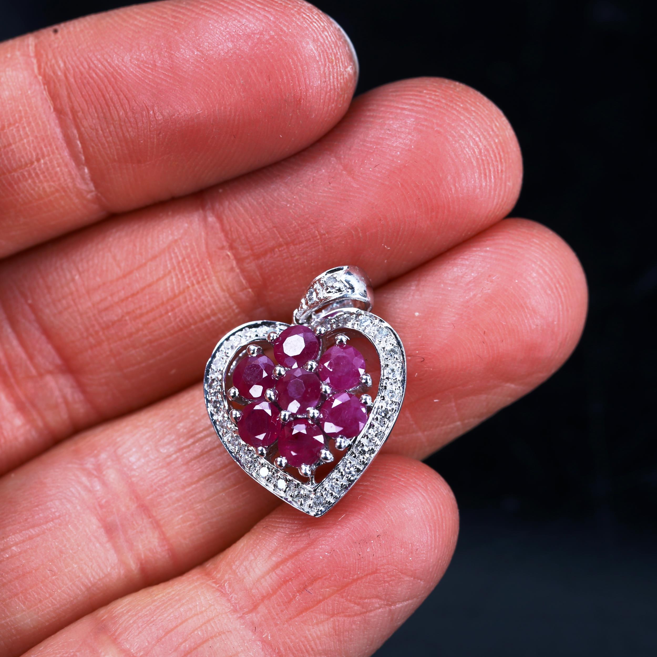 A modern 9ct white gold ruby and diamond cluster heart pendant, pendant height 23.1mm, 2.5g No - Image 4 of 4