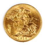 A George V 1918 gold full sovereign coin, India, Bombay Mint, 7.9g