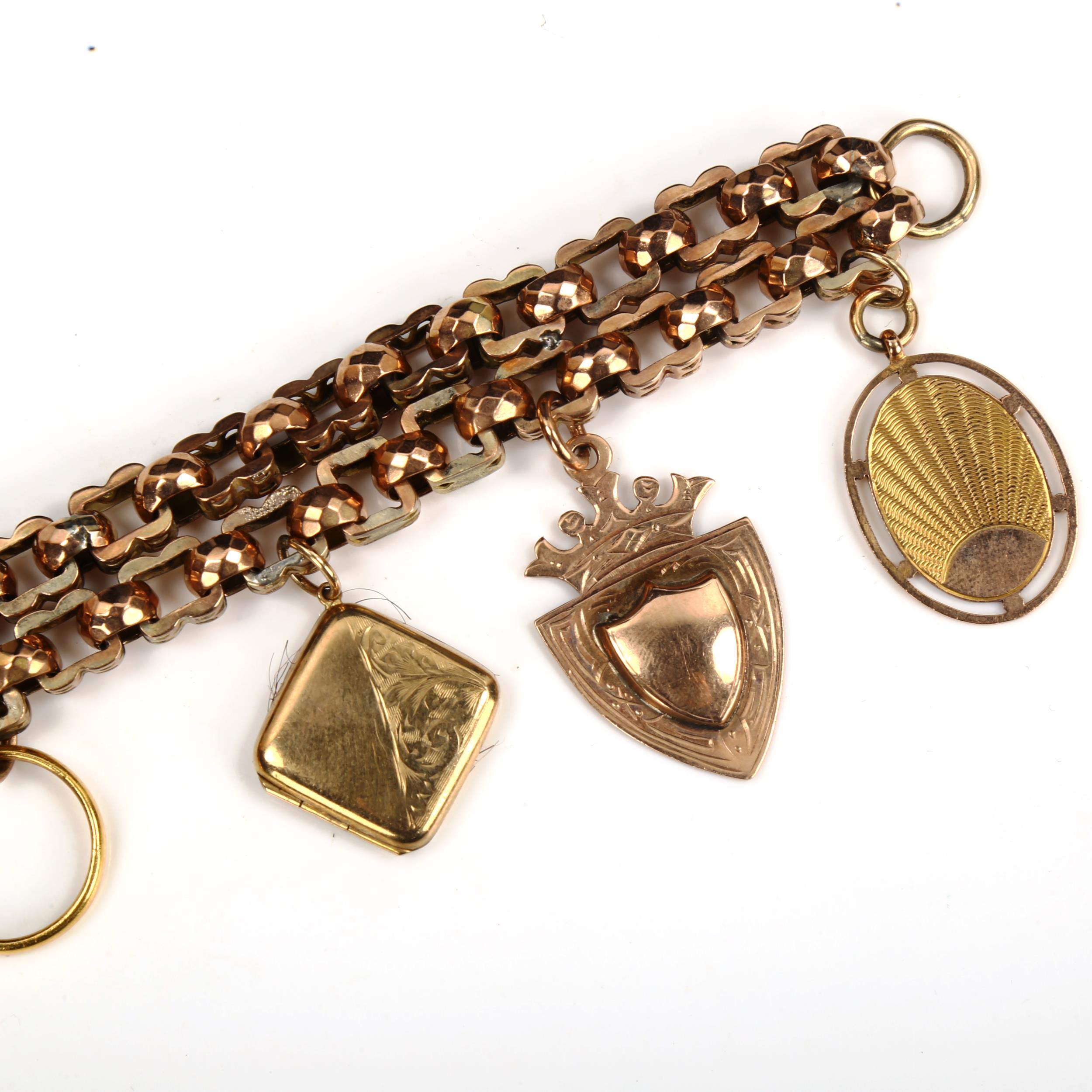 An unmarked gold double fancy link chain charm bracelet, tests as 9ct, with various charms, - Image 2 of 5