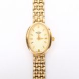 ROTARY - a lady's 9ct gold quartz bracelet watch, oval champagne dial with baton hour markers and