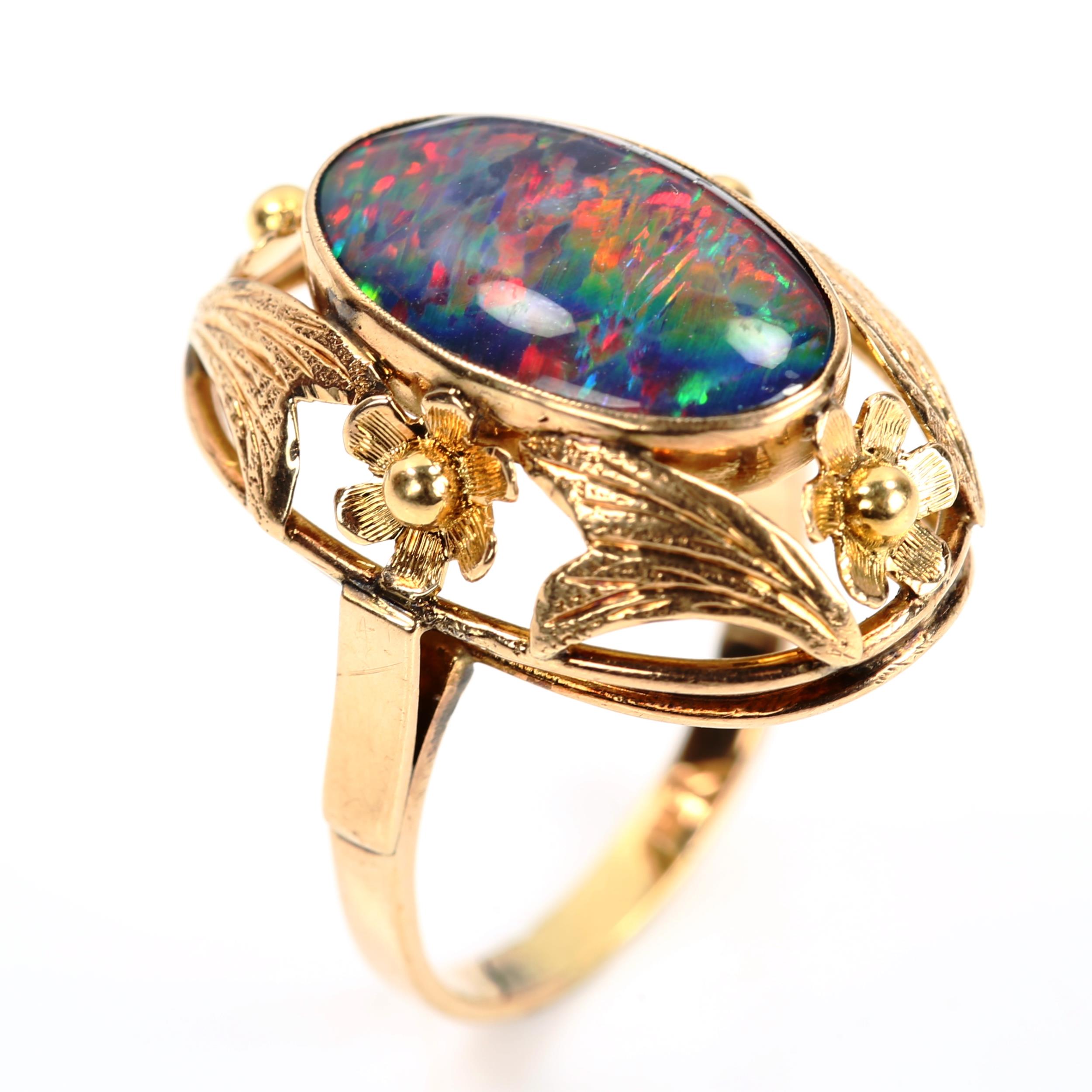 A large Continental black opal doublet dress ring, unmarked gold settings with floral bezel, setting - Image 2 of 4