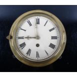 A 19th century brass-fronted circular dial bulkhead 30-hour wall clock, cream enamel dial with Roman