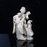 A Japanese ivory okimono, woman and children with a toy horse, signed, height 13.5cm