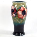 MOORCROFT POTTERY - a Poppy design vase, painted signature, height 20cm
