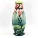 Doulton Lambeth faience baluster vase, late 19th century, hand painted cyclamen on green ground,