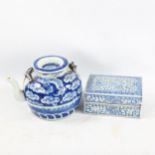 A Chinese blue and white porcelain dragon teapot, height 12cm, and a blue and white porcelain