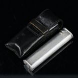 A Dunhill silver plated pocket lighter in leather case, length 7cm