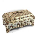 A Moroccan Berber white metal casket, with inset cabochon coral and turquoise, length 32cm