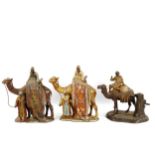 3 Austrian cold painted spelter table lighters, in the form of a camel and rider, height 16cm