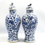 A pair of 19th century Chinese blue and white porcelain jars and covers with dragon decoration, 4
