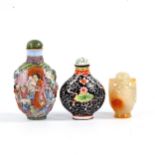 3 Chinese snuff bottles, comprising a relief carved jade bottle with stopper, height 4.5cm, a relief