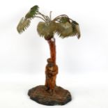 Austrian cold painted spelter lamp in the form of an Arab under a palm tree, early 20th century,