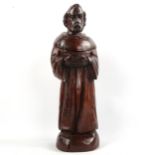 A carved wood figure of a standing monk, late 19th/early 20th century, height 48cm