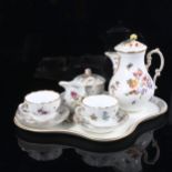 A German white glaze porcelain Tea for Two set on matching tray, with hand painted botanical
